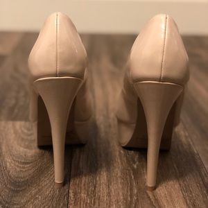 Nude patent pumps